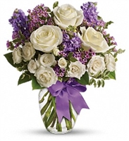 With its elegant mix of white roses, spray roses, lavender stock, and delicate waxflower, this bouquet is a heartfelt gift thatâ€™s sure to be cherished.